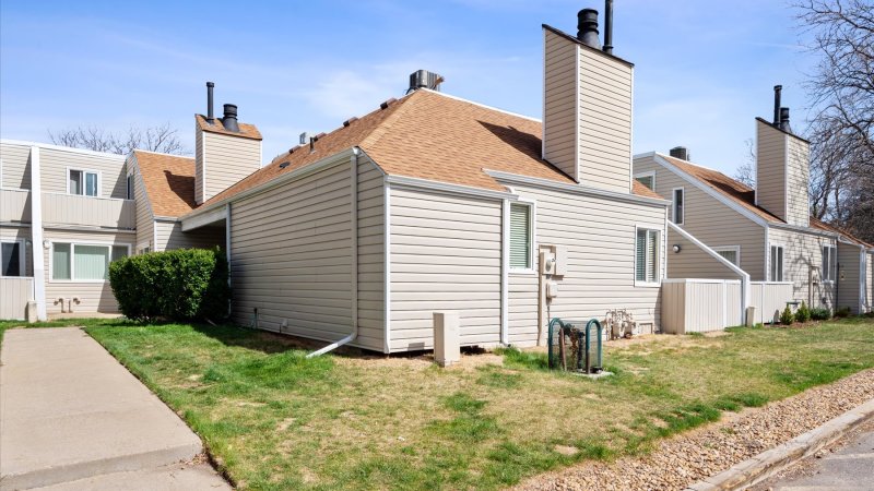 Townhome exterior with a front lawn