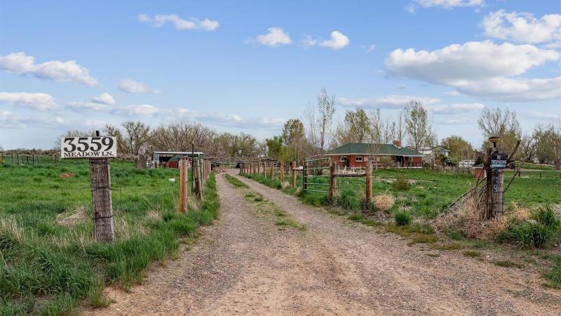 Driveway to 3559 Meadow Lane, a 3-acre property in Brighton, CO